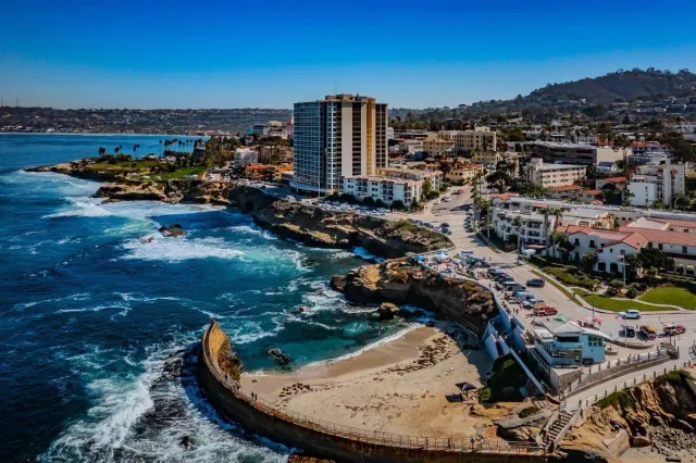 an aerial view of a house with a ocean view