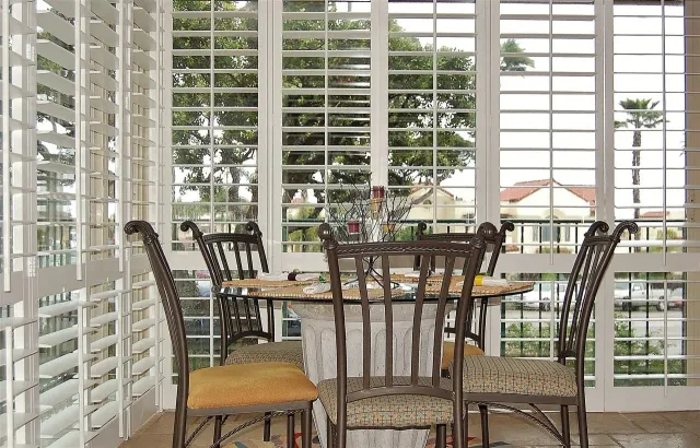 a view of a balcony with chairs