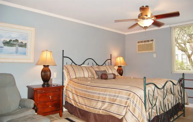 a bedroom with a bed and window