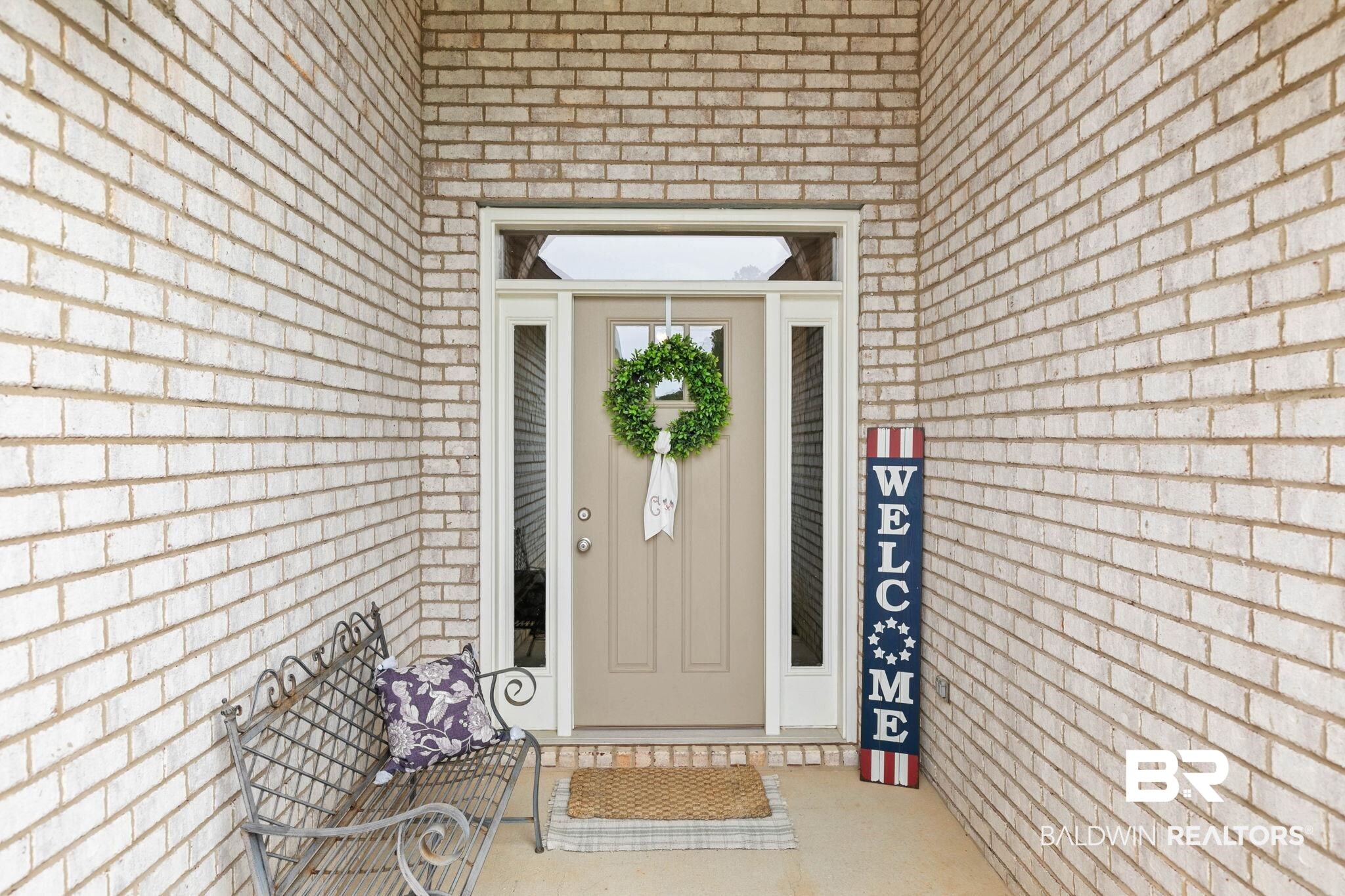 31187 Spoonbill Road Daphne, AL 36527 - Photo 6 of 85 Entryway featuring light-colored brick exterior