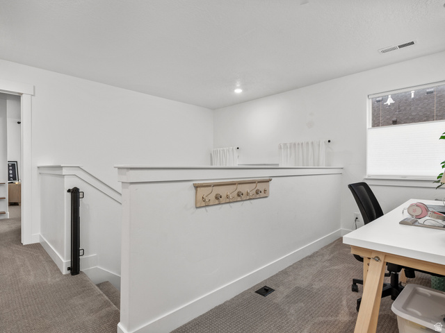 627 South Meade Street Mapleton, UT 84664 - Photo 37 of 48 Upper-level landing featuring neutral carpet flooring, crisp white walls, and bright overhead lighting