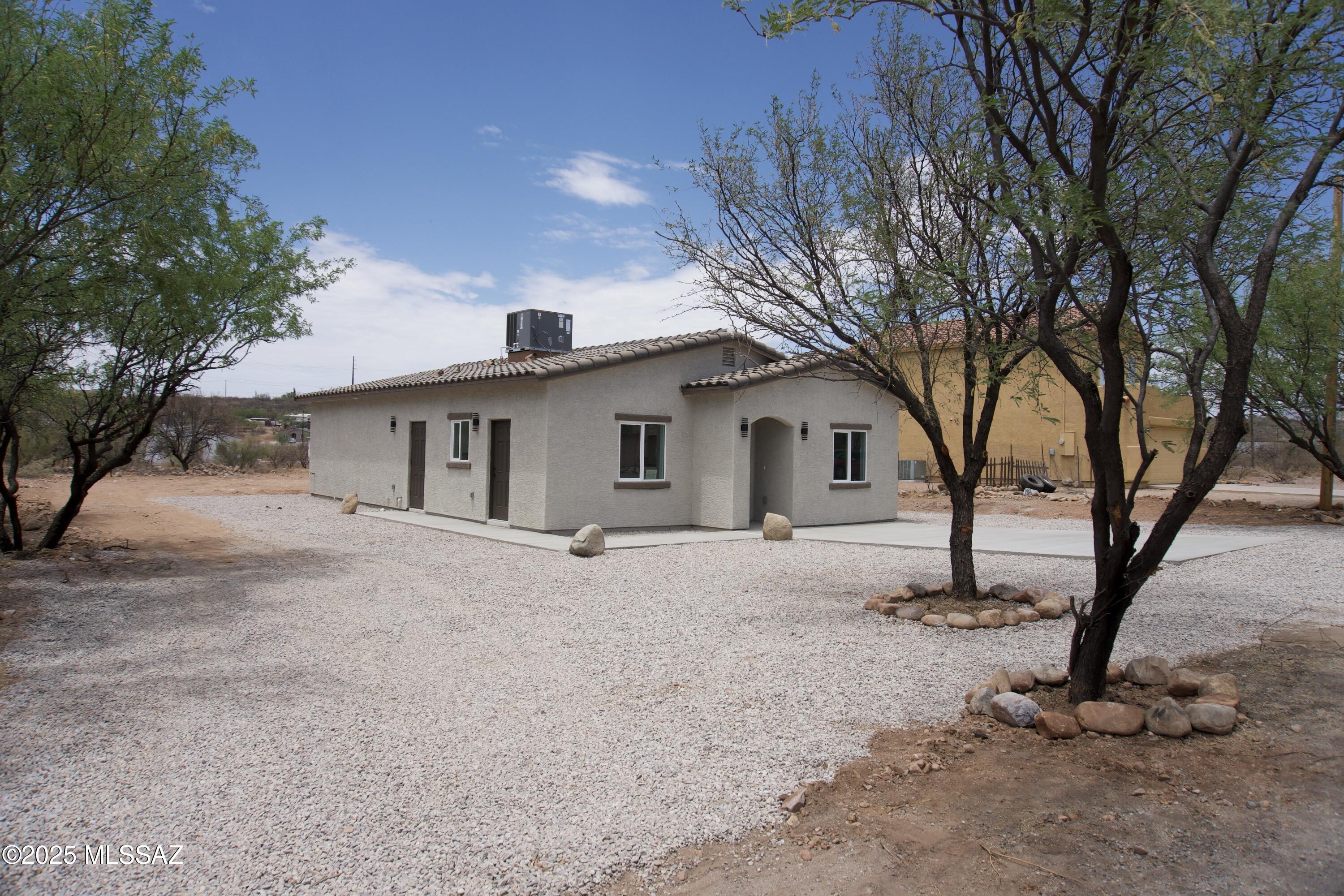126 Alemania Court Rio Rico, AZ 85648 - Photo 6 of 31 a view of a house with a yard