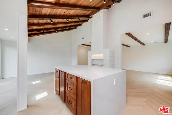 a view of a hallway with seating area