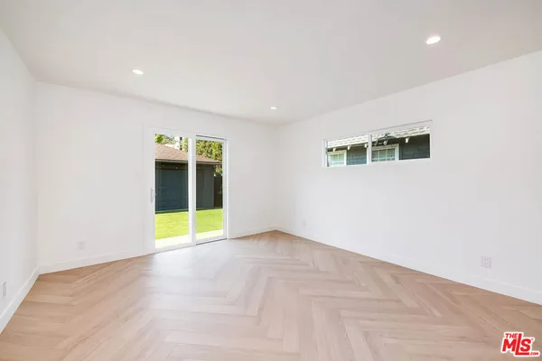 a view of an empty room with a fireplace