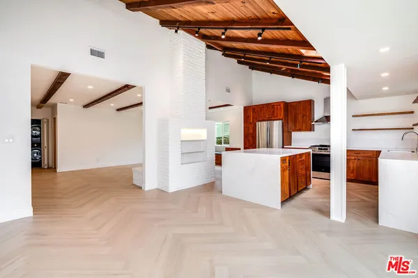 a view of a living room and kitchen