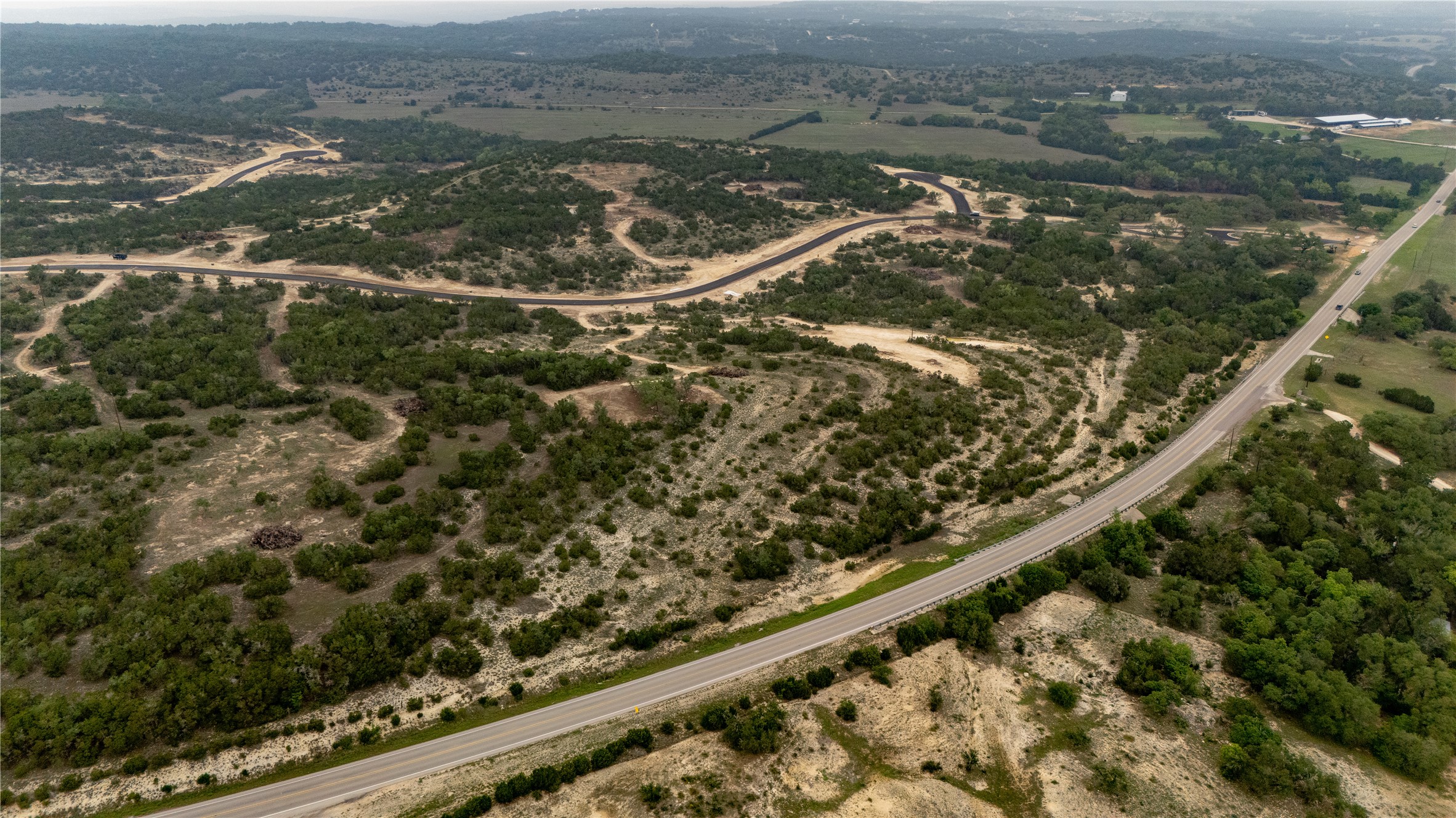 Lot 5 Ranch Road 165 Dripping Springs, TX 78620 - Photo 6 of 12 Expansive acreage featuring established roadways and natural tree coverage
