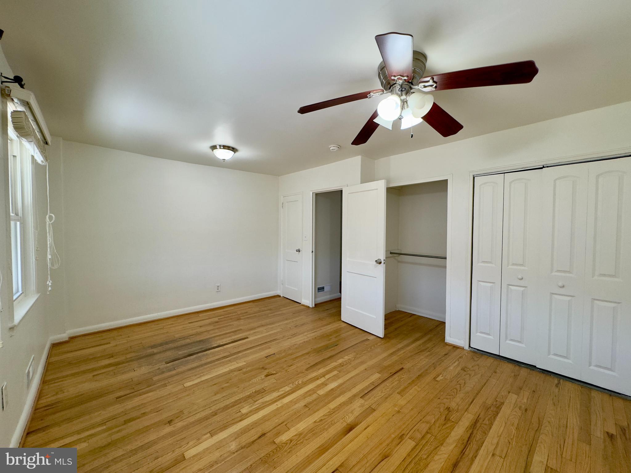 512 Umbra Street Baltimore, MD 21224 - Photo 12 of 20 a view of empty room with wooden floor
