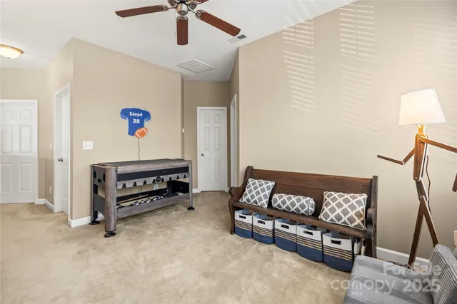 a view of a dining room with furniture and window