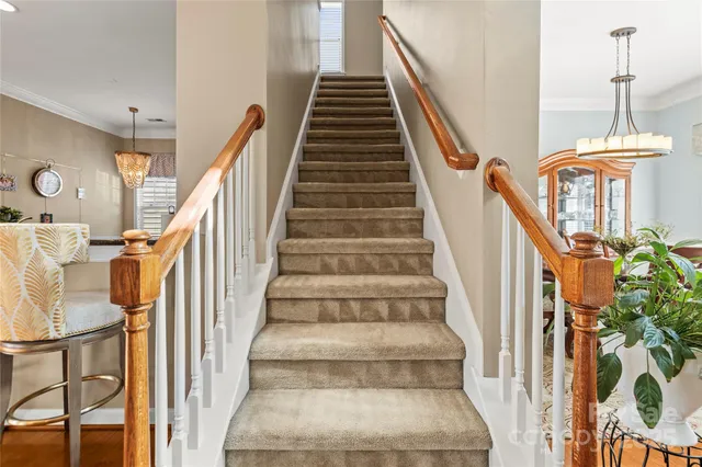 a kitchen with stainless steel appliances granite countertop wooden cabinets a sink and a stove