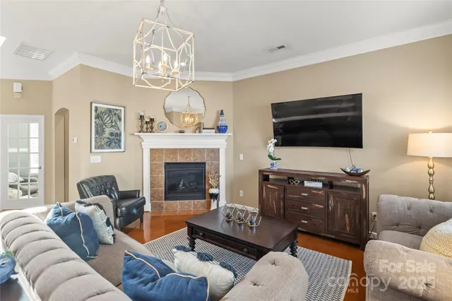 a living room with kitchen island furniture and a large window