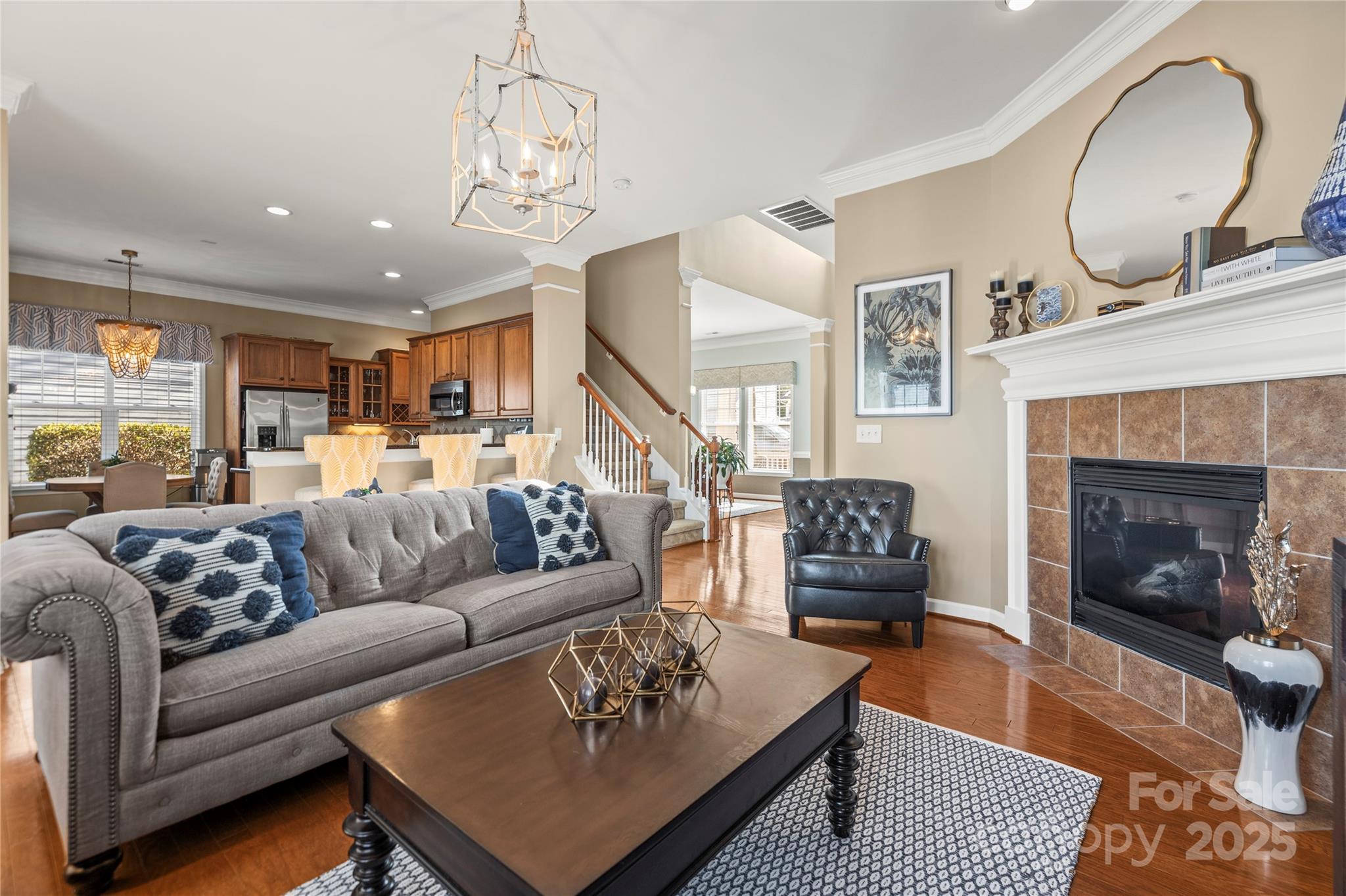 9415 Rosalyn Glen Road Cornelius, NC 28031 - Photo 28 of 46 a living room with furniture and a fireplace