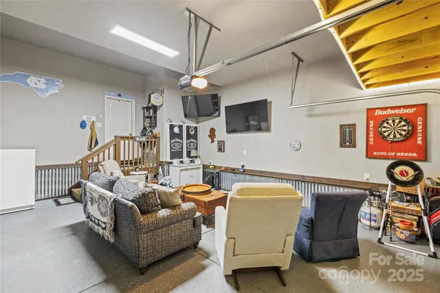 a view of a patio with table and chairs and wooden floor
