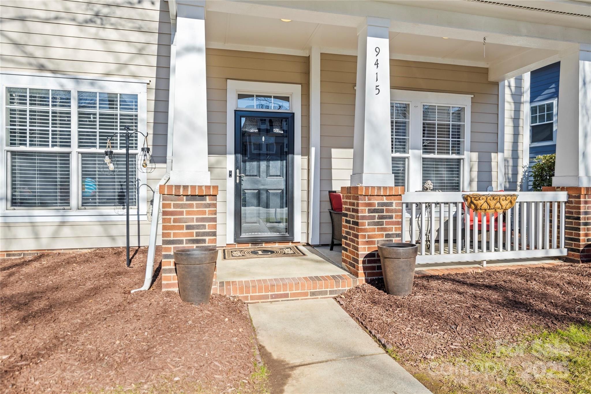 9415 Rosalyn Glen Road Cornelius, NC 28031 - Photo 35 of 46 a front view of a house with a porch