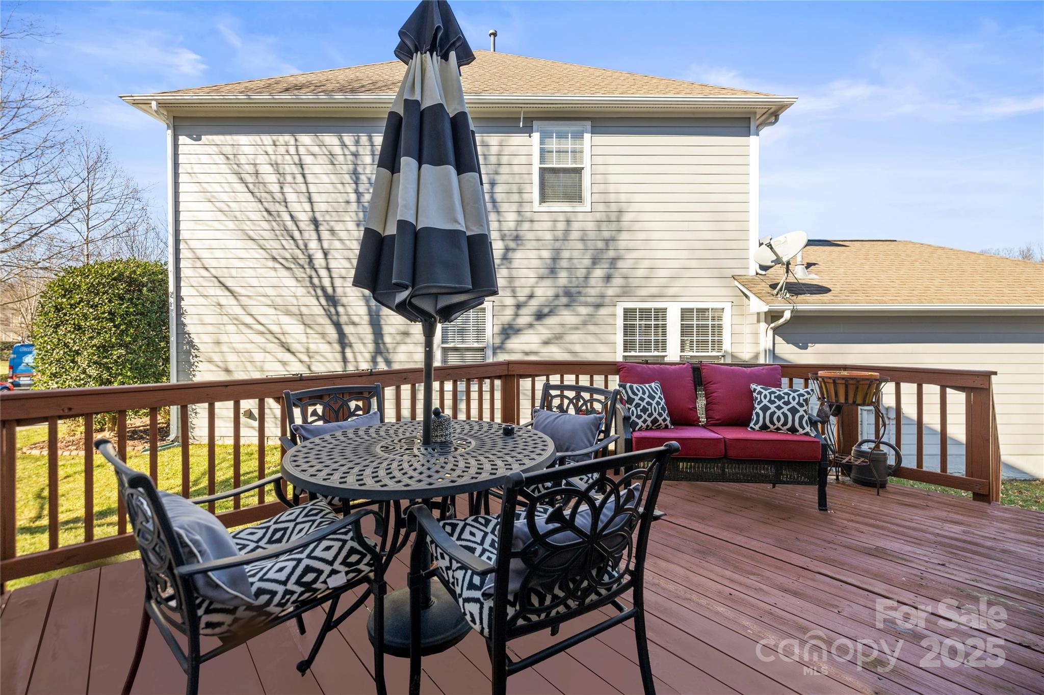 9415 Rosalyn Glen Road Cornelius, NC 28031 - Photo 46 of 46 a table and chairs in front of a house