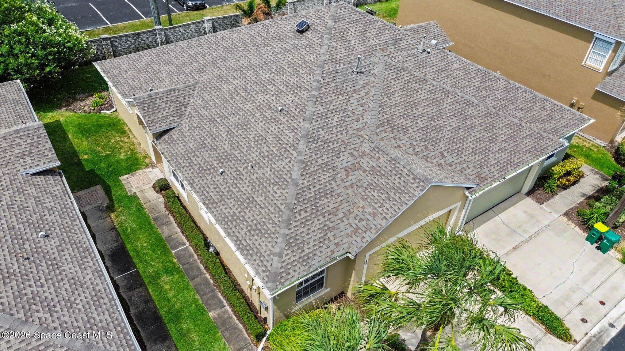 284 Intrepid Way Indialantic, FL 32903 - Photo 29 of 36 a aerial view of a house with a yard and potted plants
