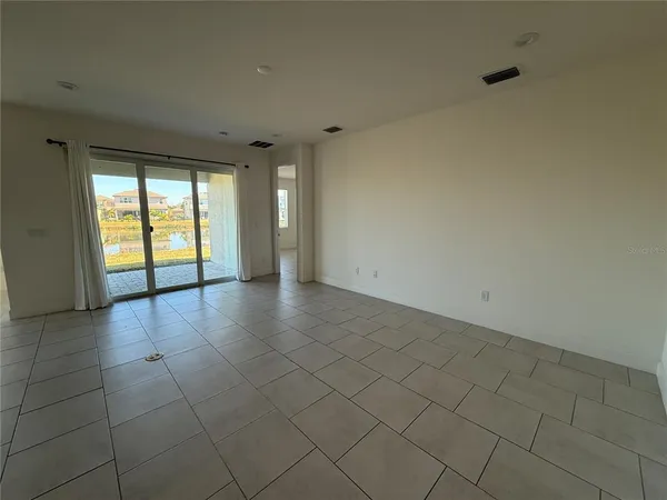 a view of an empty room and window