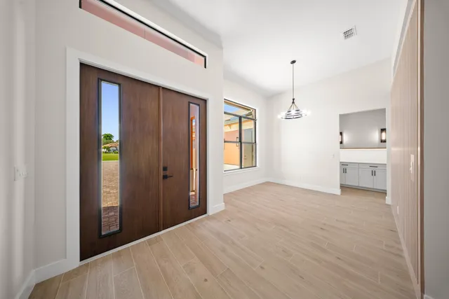 a large kitchen with stainless steel appliances lots of counter space sink and cabinets