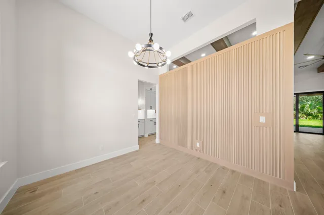 a large bathroom with a bathtub sink and mirror