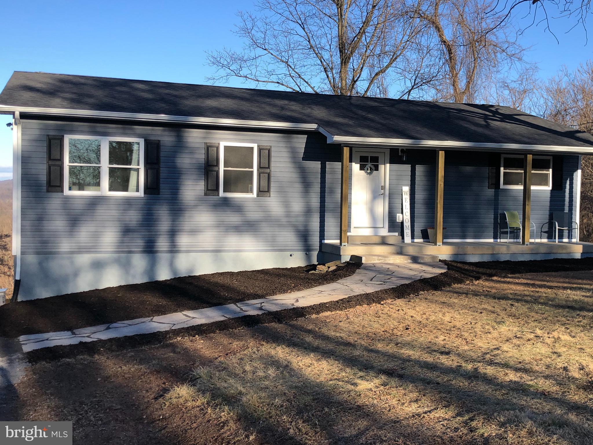 138 Grimes Golden Road Linden, VA 22642 - Photo 2 of 77 a front view of a house with a yard
