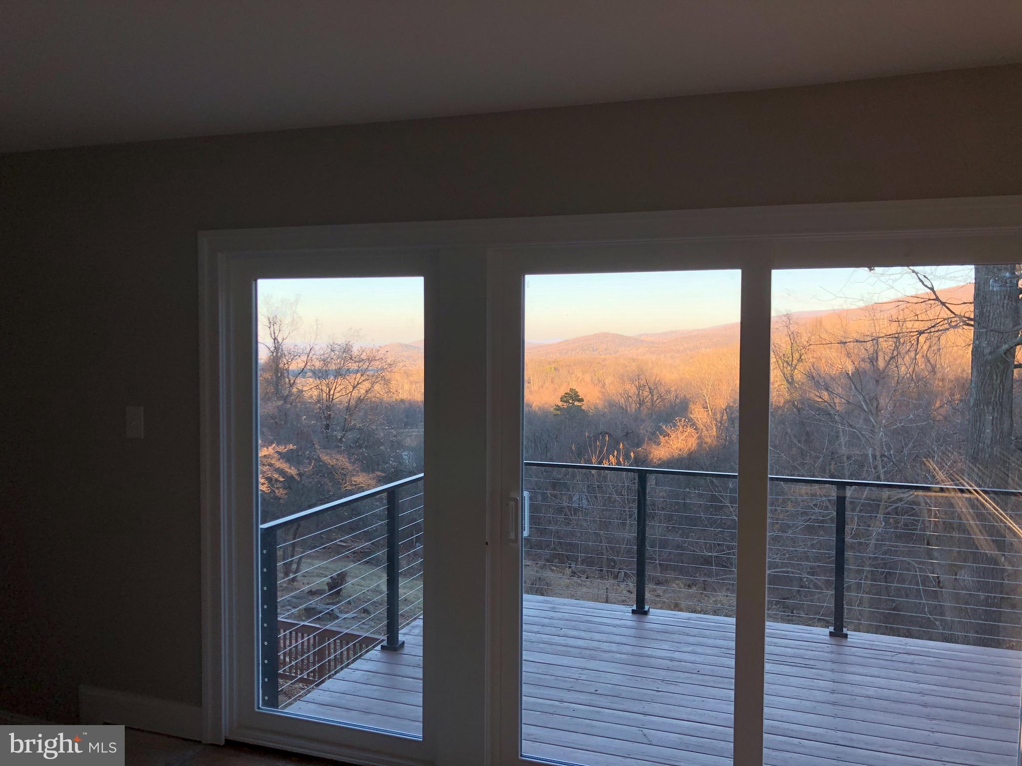 138 Grimes Golden Road Linden, VA 22642 - Photo 13 of 77 3 panels of windows /door off living room to deck