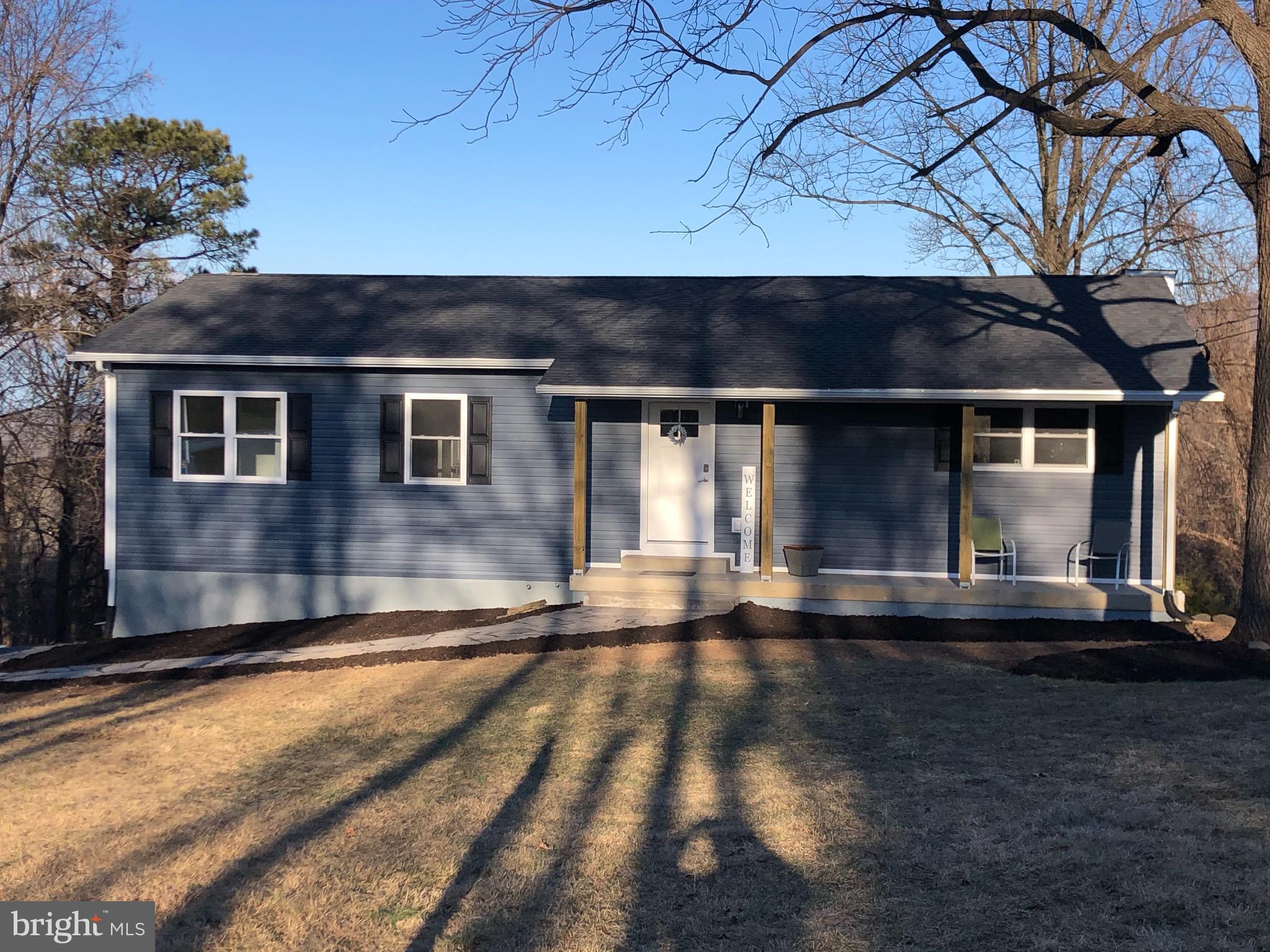 138 Grimes Golden Road Linden, VA 22642 - Photo 3 of 77 a front view of a house with a yard