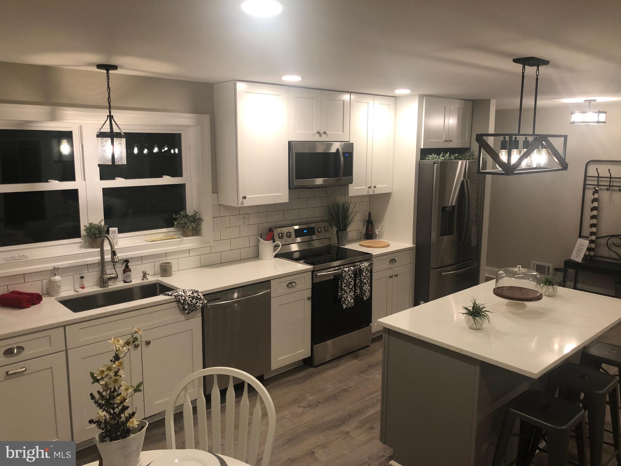 138 Grimes Golden Road Linden, VA 22642 - Photo 25 of 77 a kitchen with a sink stainless steel appliances and refrigerator