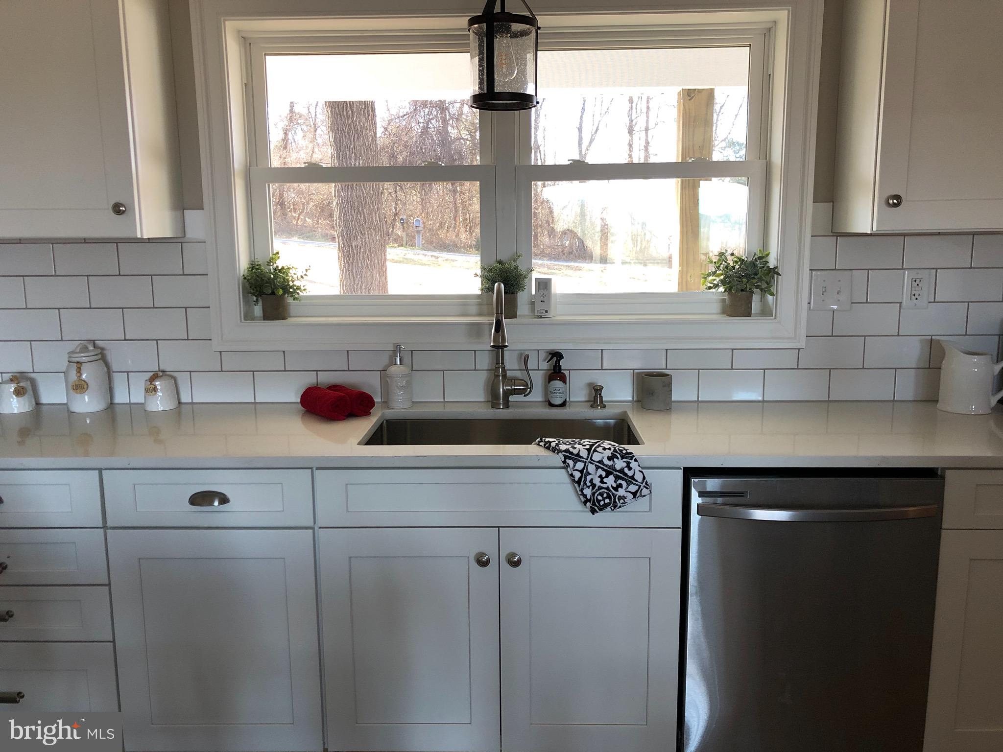 138 Grimes Golden Road Linden, VA 22642 - Photo 31 of 77 a kitchen with a window a sink and a window