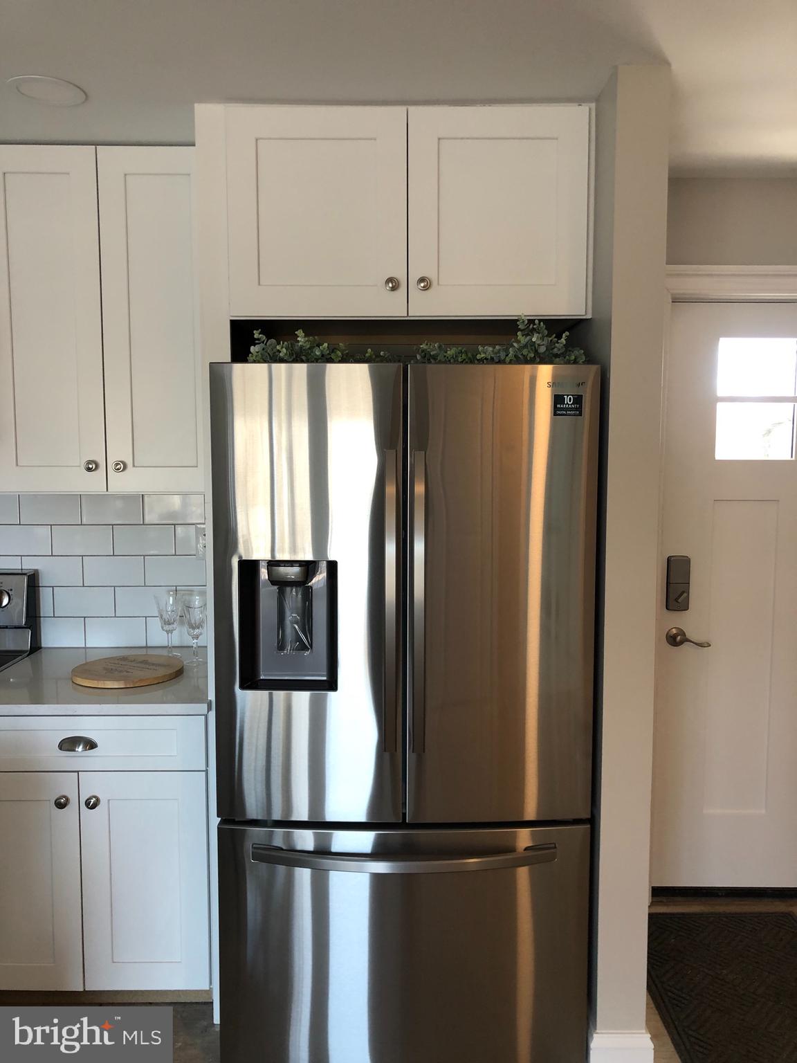 138 Grimes Golden Road Linden, VA 22642 - Photo 32 of 77 a kitchen with stainless steel appliances granite countertop a refrigerator and a sink