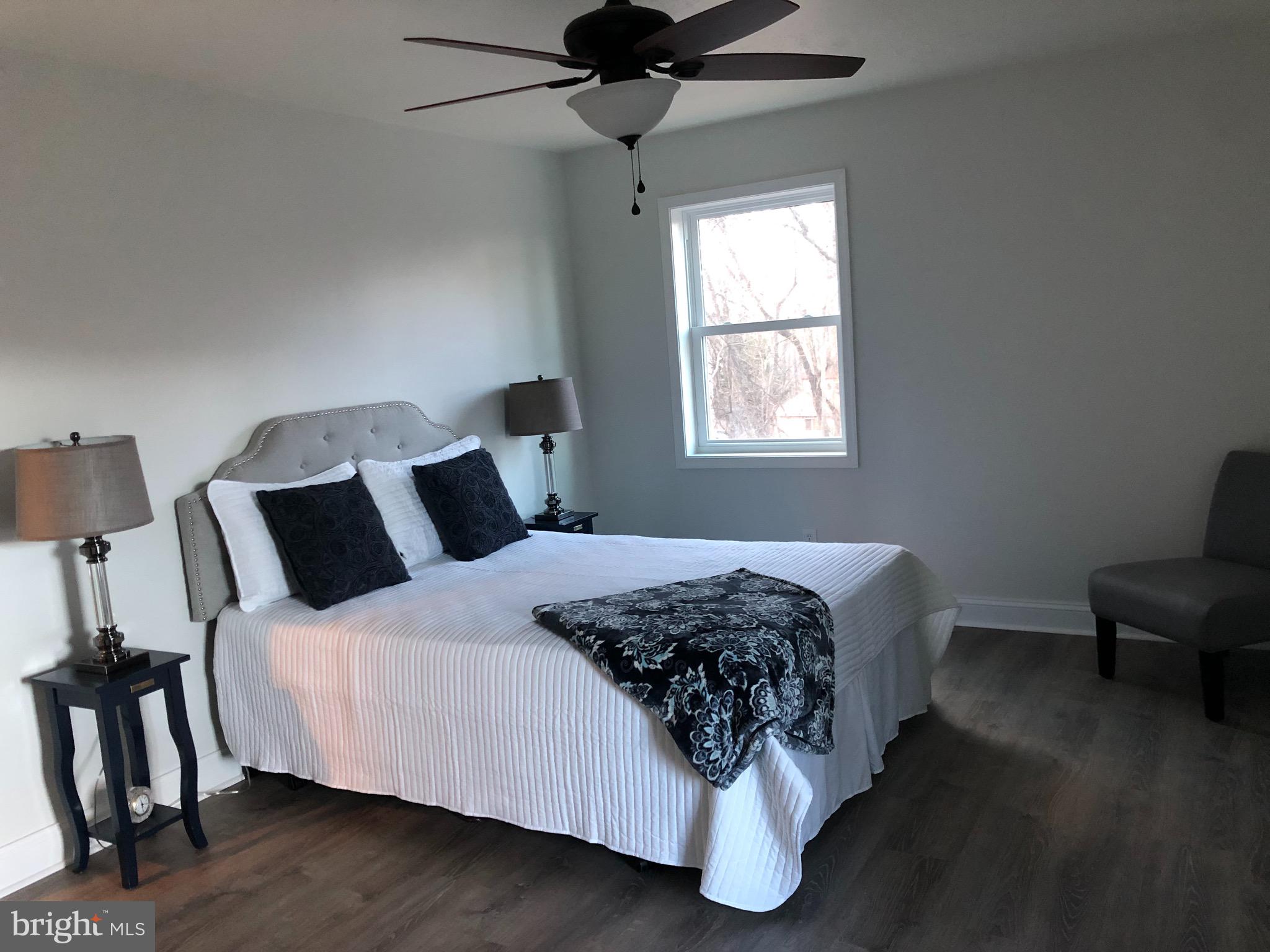 138 Grimes Golden Road Linden, VA 22642 - Photo 38 of 77 a bedroom with a bed and wooden floor