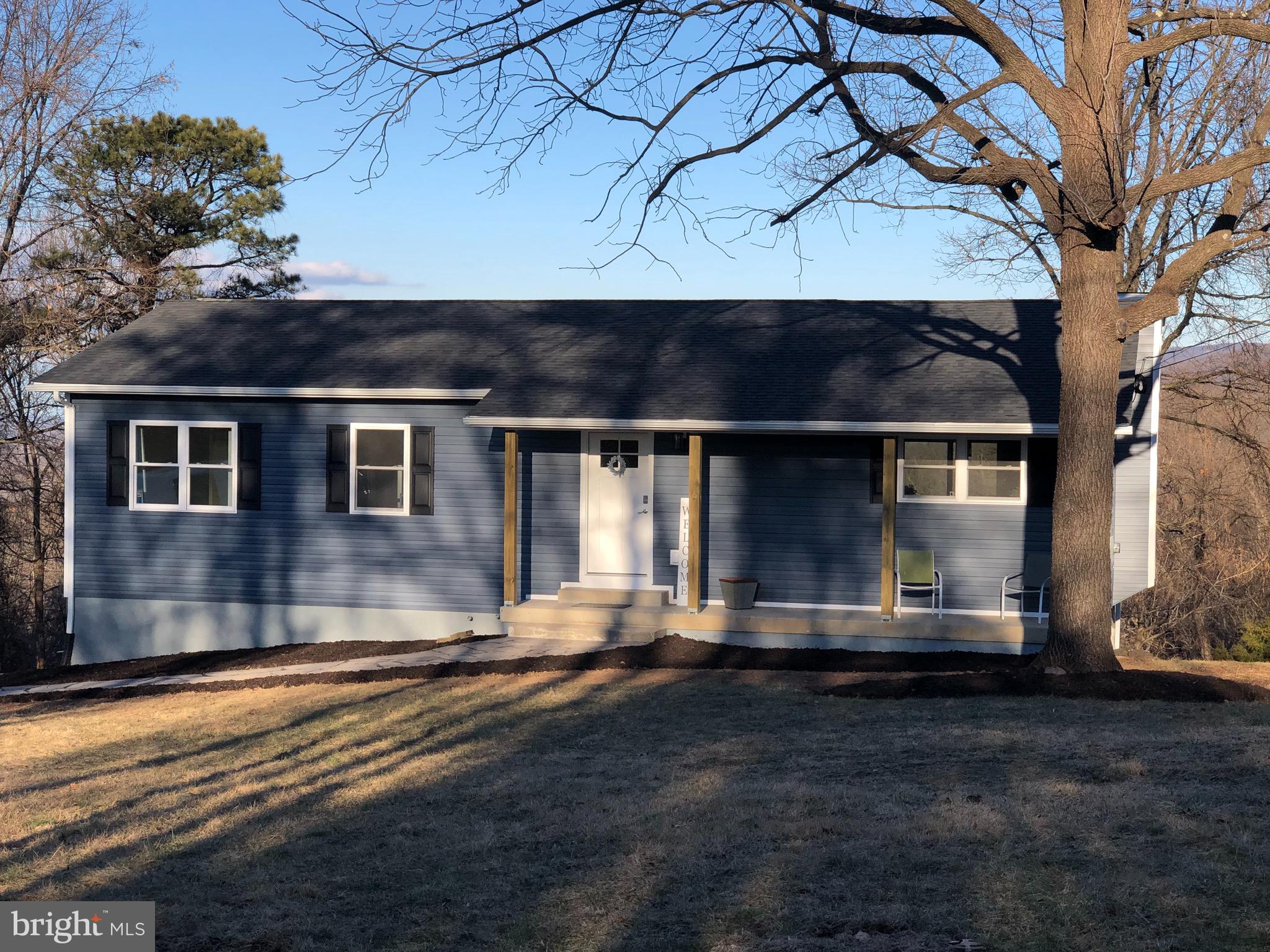 138 Grimes Golden Road Linden, VA 22642 - Photo 5 of 77 a front view of a house with a yard