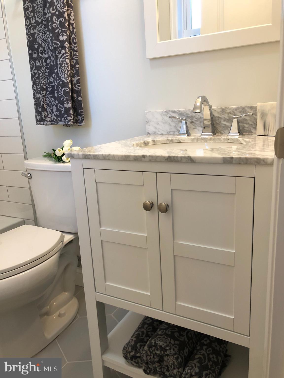 138 Grimes Golden Road Linden, VA 22642 - Photo 45 of 77 a bathroom with a granite countertop toilet and a sink
