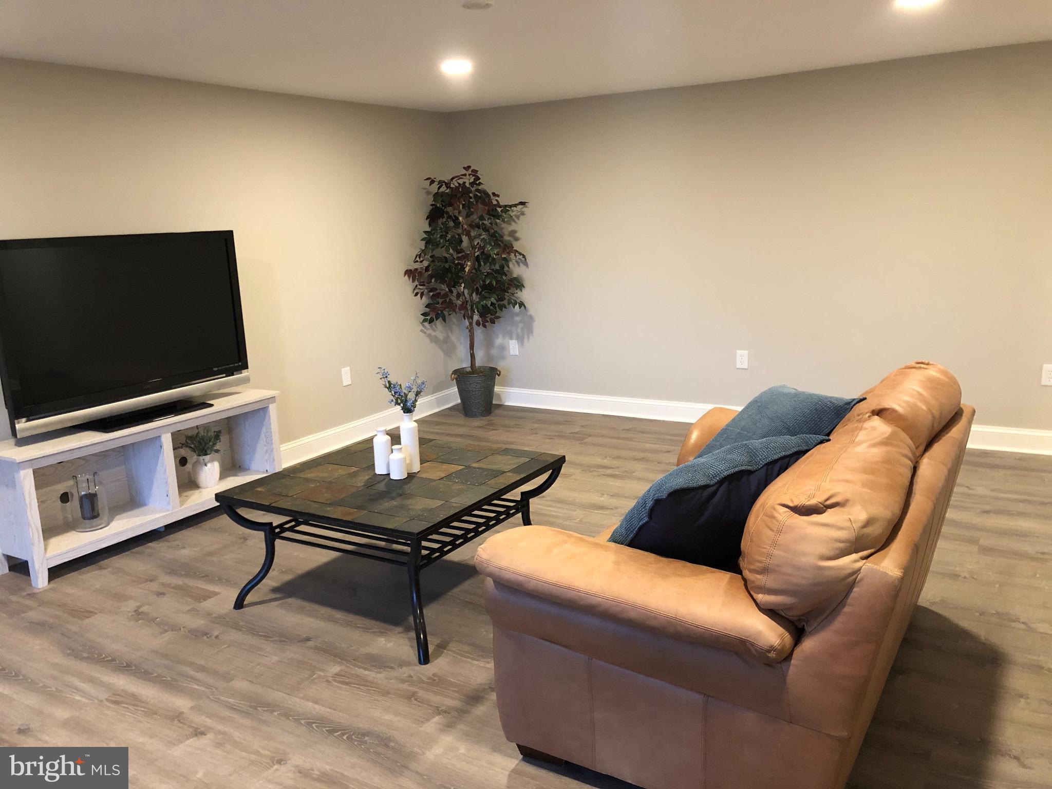 138 Grimes Golden Road Linden, VA 22642 - Photo 68 of 77 a living room with furniture and a flat screen tv