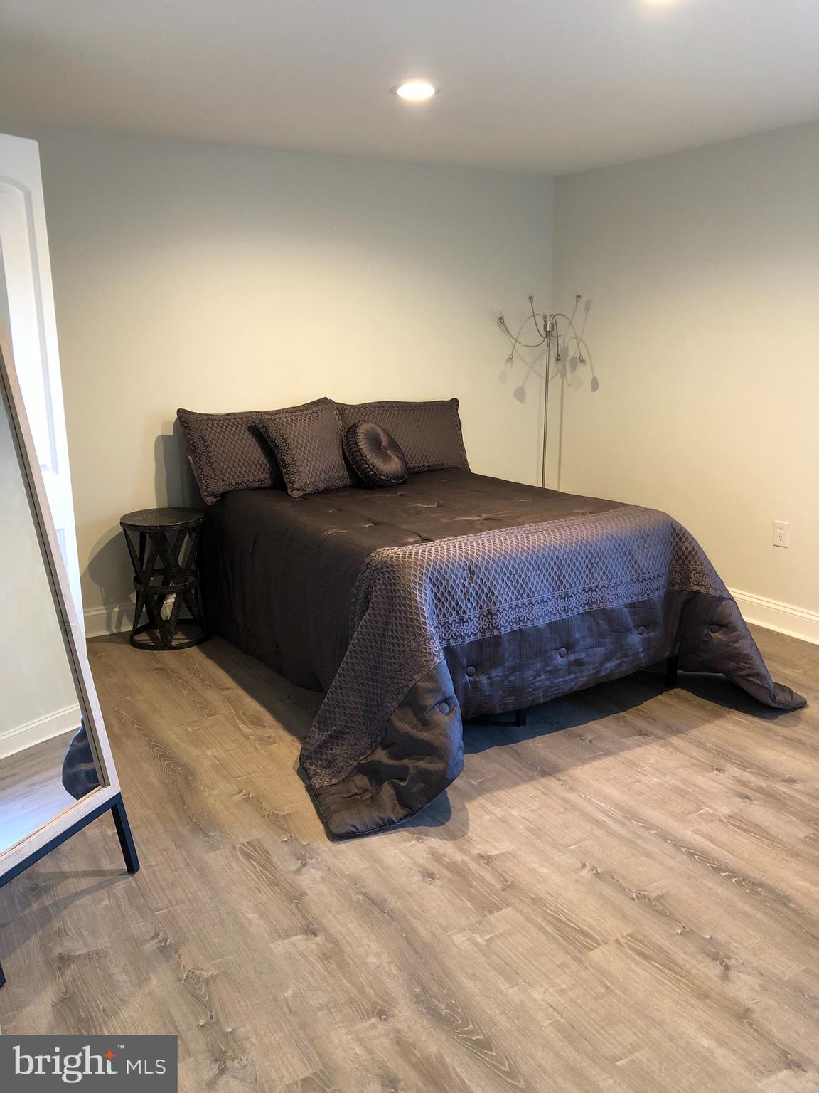 138 Grimes Golden Road Linden, VA 22642 - Photo 72 of 77 a spacious bedroom with a bed and a stove