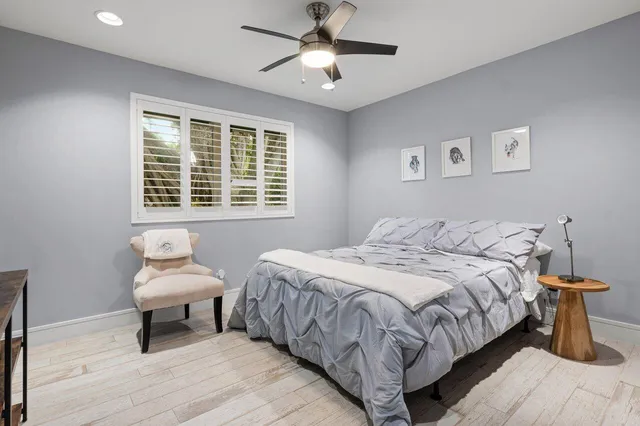 a bathroom with a sink toilet and a mirror