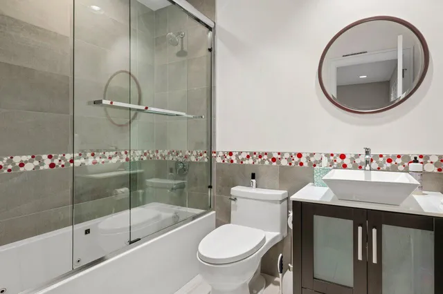 a view of a storage and utility room with a washer dryer