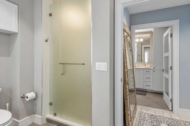 a bathroom with double sink and a mirror