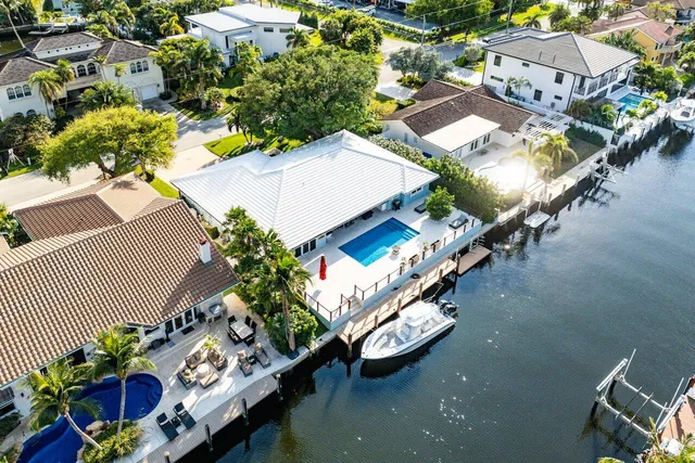 an aerial view of residential houses with outdoor space