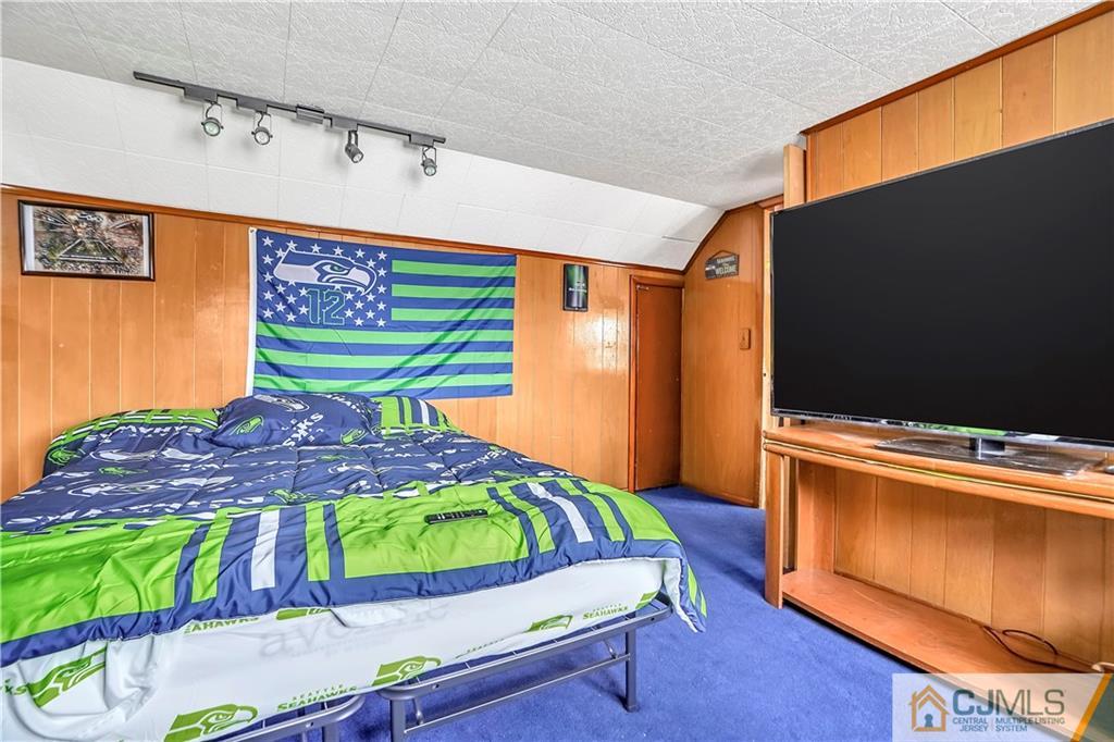 141 Old Road Sewaren, NJ 07077 - Photo 13 of 30 a room with furniture and a flat screen tv