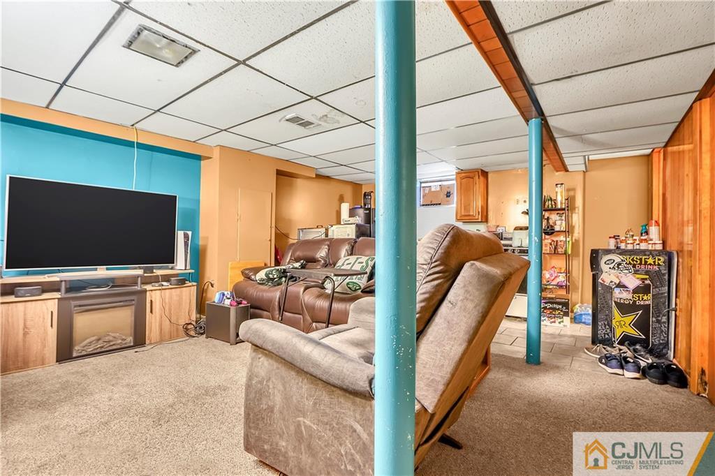 141 Old Road Sewaren, NJ 07077 - Photo 18 of 30 a view of living room with furniture and a flat screen tv