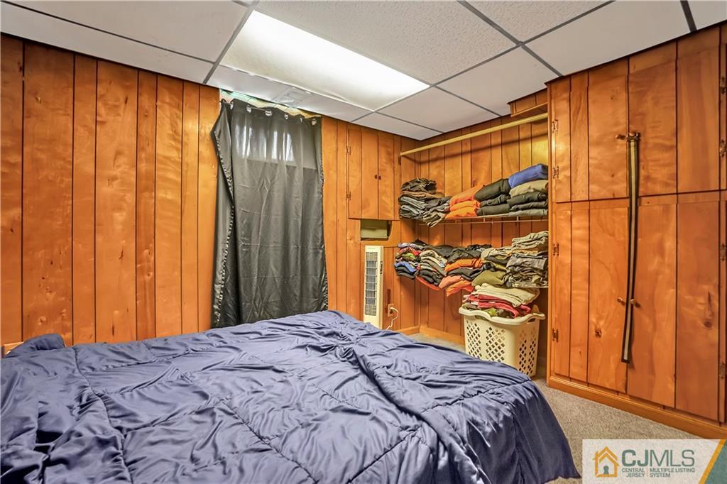 141 Old Road Sewaren, NJ 07077 - Photo 21 of 30 a bedroom with a bed and a dresser