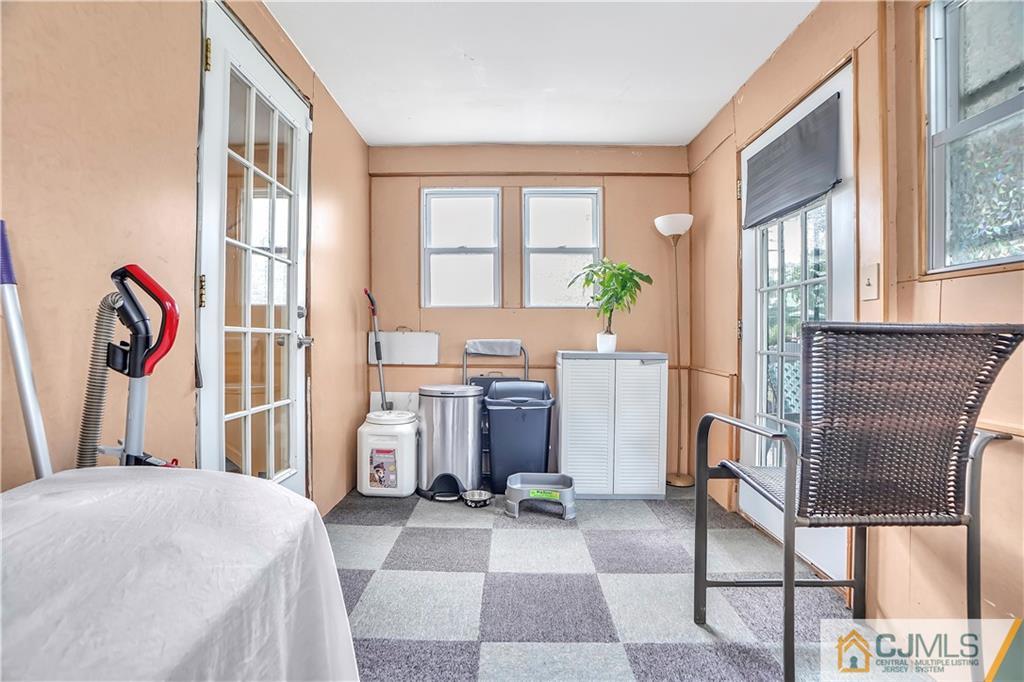 141 Old Road Sewaren, NJ 07077 - Photo 24 of 30 a bedroom with a bed next to a window with outer view