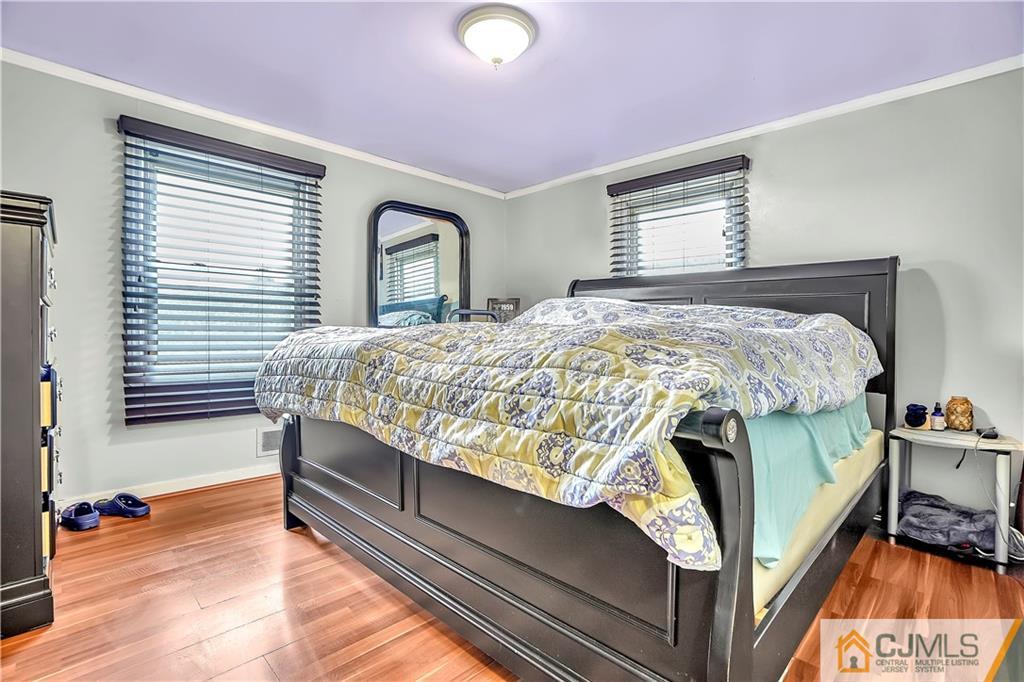 141 Old Road Sewaren, NJ 07077 - Photo 8 of 30 a bedroom with a bed and a window