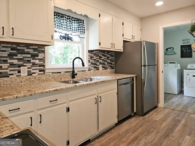 a utility room with dryer and washer