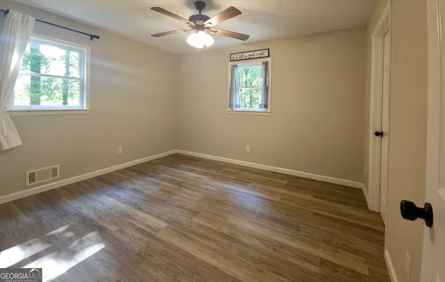 a bathroom with a double vanity sink and mirror