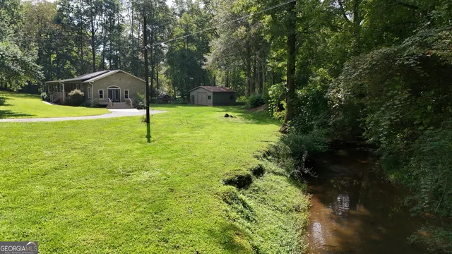 a view of a house with a yard