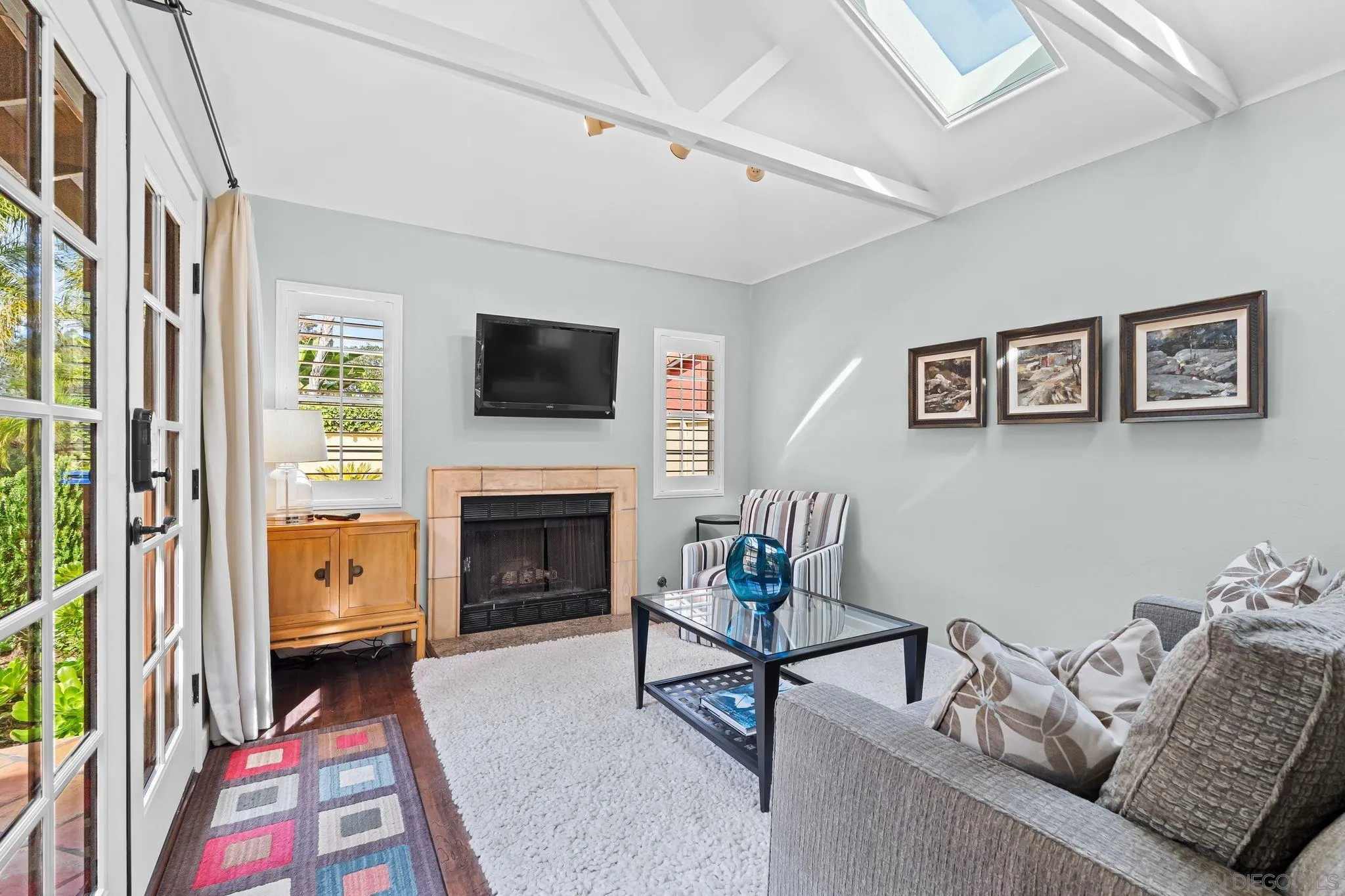 2969 Racetrack View Drive Del Mar, CA 92014 - Photo 53 of 59 a living room with furniture a flat screen tv and a fireplace