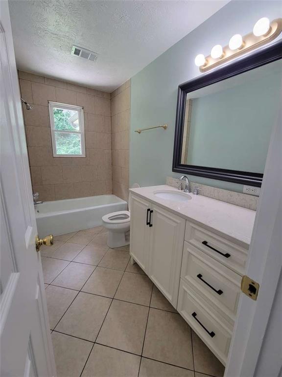4648 Pine Tree Circle, Unit B Buford, GA 30518 - Photo 13 of 19 a bathroom with a toilet sink and mirror