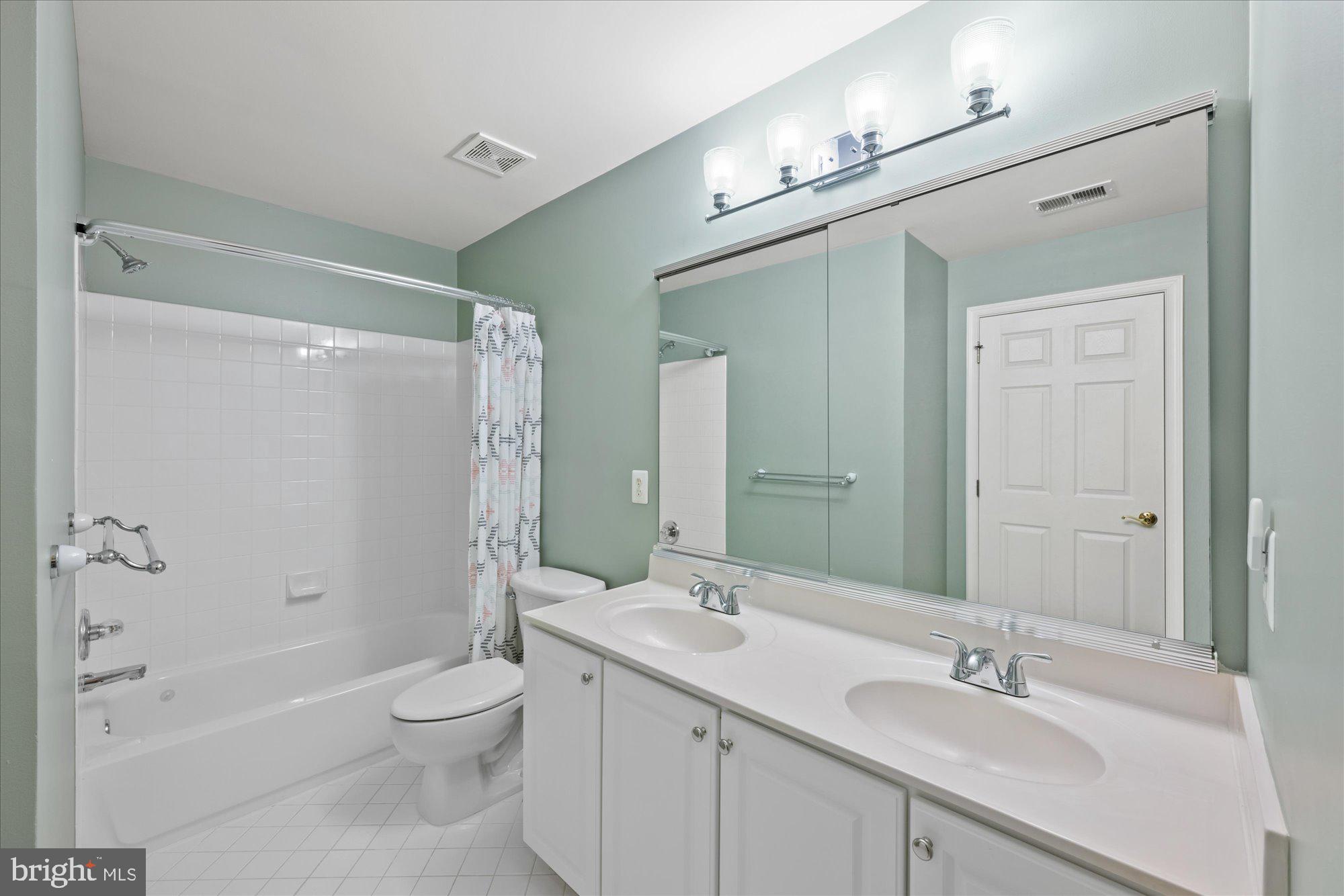 20026 Valhalla Square Ashburn, VA 20147 - Photo 27 of 82 a bathroom with a sink a toilet and shower