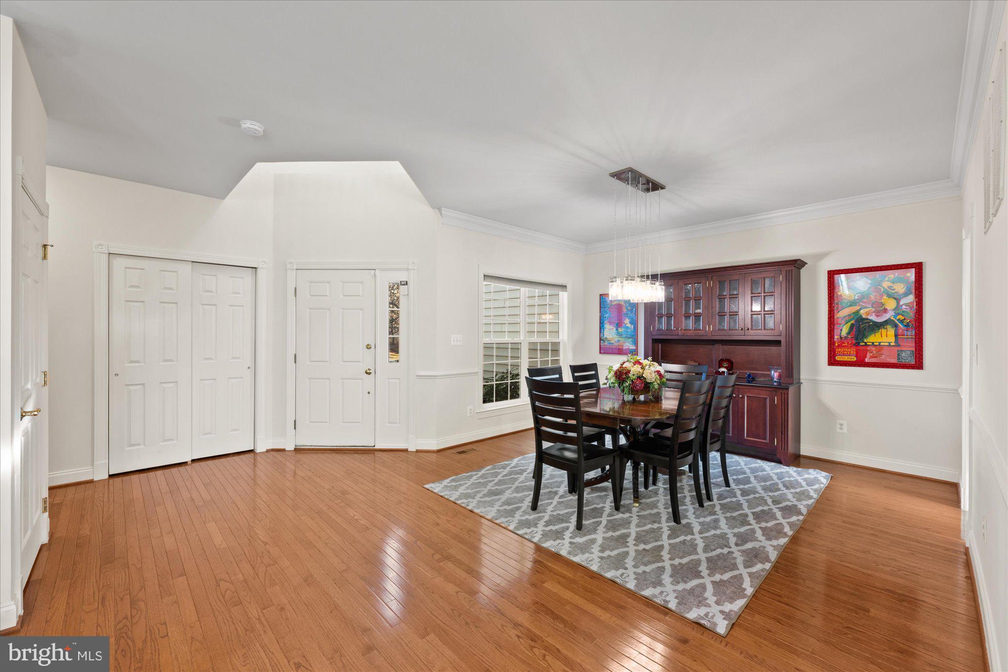 20026 Valhalla Square Ashburn, VA 20147 - Photo 77 of 82 a dining room with furniture a chandelier and wooden floor
