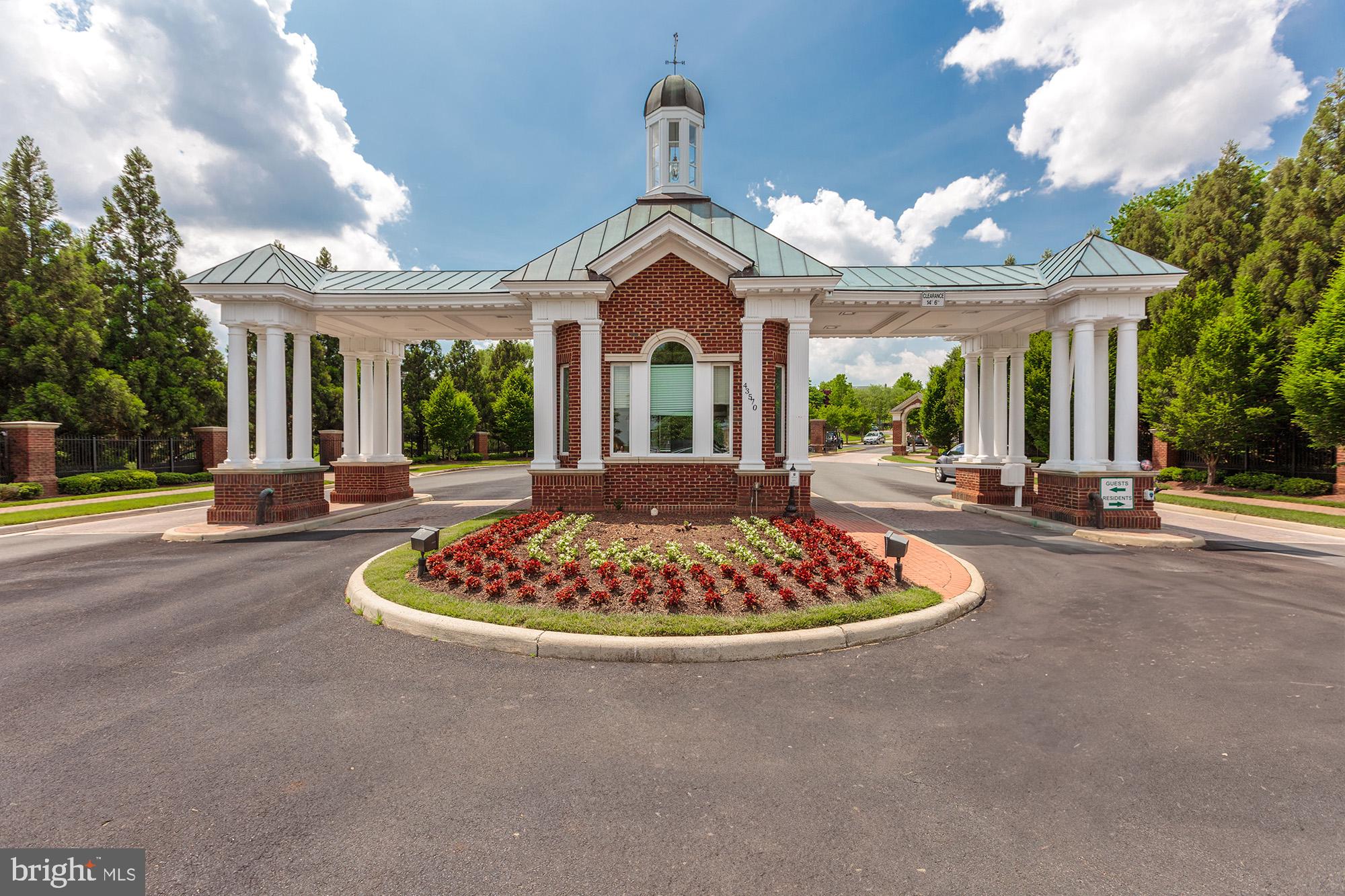 20026 Valhalla Square Ashburn, VA 20147 - Photo 40 of 82 a view of a white house with a large windows and a chandelier